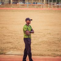 Portrait of Olesya Verbova, a smiling lifestyle coach with athletic build.